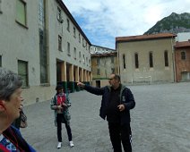 A volunteer guide explains Campanile San Nicolò. A volunteer guide explains Campanile San Nicolò, before we climb to the top. Amy, our "Trip Experience Leader" is making sure he gets everything right.