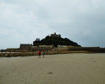 Saint Michael's Mount, Cornwall, England showing the causeway during low tide. In a few hours the tide will cover the causeway. The island can only be accessed by ferry while the tide is in.