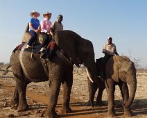 ElephantGameViewing Joyce and Sylvia try some game viewing from elephant back. Mom elephants seems more interested in baby than game or her riders.