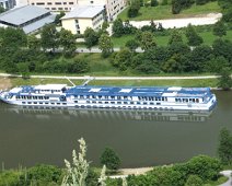 B00_Rhapsody01_TopView Our ship, the M/S River Rhapsody. She is 38' wide and 366' long with a capacity of 140 and a crew of 34. Note the deck chairs and canopies folded up for going...