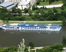 B00_Rhapsody01_TopView Our ship, the M/S River Rhapsody. She is 38' wide and 366' long with a capacity of 140 and a crew of 34. Note the deck chairs and canopies folded up for going...