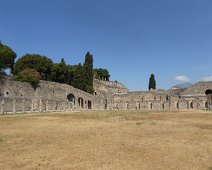 Pompeii Forum with ampitheater in the background, and even further back a little bit of Mt. Vesuvius is visible. Pompeii Forum with ampitheater in the background, and even further back a little bit of Mt. Vesuvius is visible.