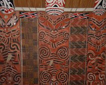 C016_MiraeCarve Closeup of the finely carved wall panels in tribal meeting house (marae) inside the Auckland Museum. Each of panels portray an important, tribal, historical...