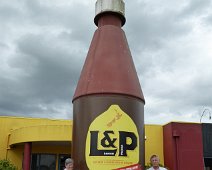 C031_WeMeLPBottle We and me posing doing the quintessential New Zealand photo beside the World's Largest L&P Bottle in Paeroa. Lemon & Paeroa, also known as L&P, is a sweet soft...