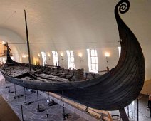 D03_M_Ship The Oseberg Viking Ship at the Viking Ship Museum in Oslo. Oseberg is richly decorated and was equipped with lavish burial gifts for the two women onboard. It...